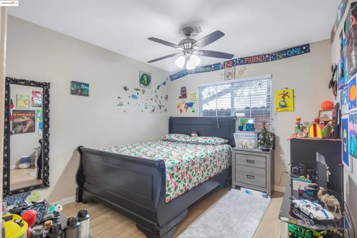 Bedroom featuring wood finished floors and a ceiling fan