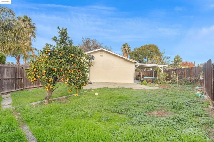 Fenced backyard featuring a patio