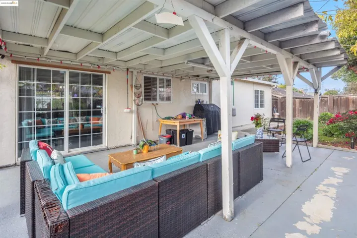 View of patio featuring outdoor lounge area and grilling area