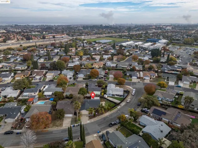 Aerial overview of property's location featuring nearby suburban area