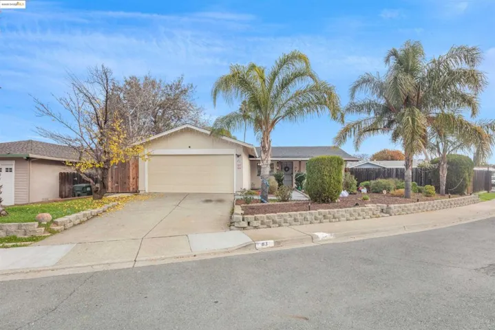 Ranch-style home with driveway and a garage