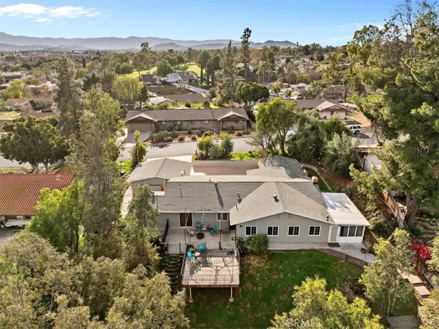 Rear Drone View of Lush Backyard