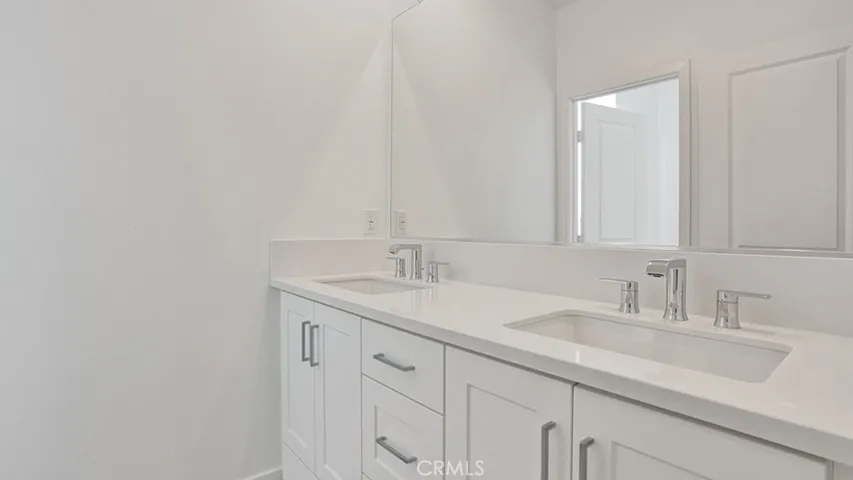 Bathroom #3. Notice dual sinks and Quartz countertops. Impeccable!
