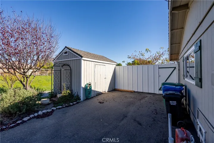 There is a storage shed ideal for yard maintenance items.