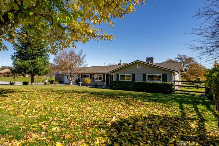Lush lawn and mature trees create a pleasing atmosphere.