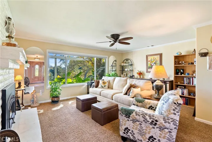 The entry opens up into the living room where you'll notice the large picture window which perfectly frames the views of the property.