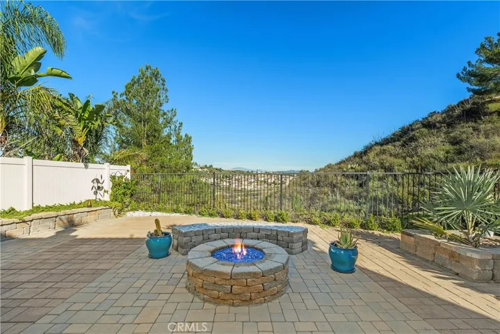 Hardscaped youar with blue-glass gas fire pit,planters,circular seating and amazing views to watch the hot air balloons!
