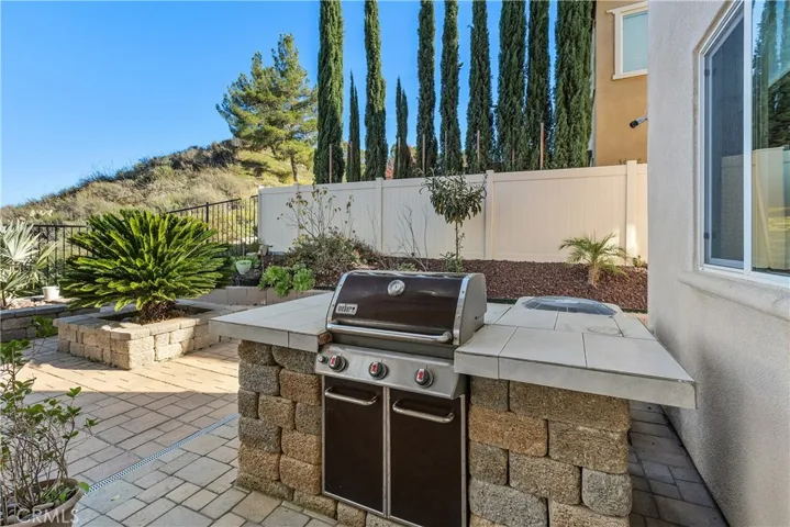 Outdoor Weber Gas grill and island.