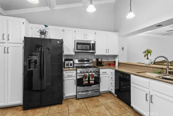 As you enter, kitchen is located to the left, very open and spacious and bright.