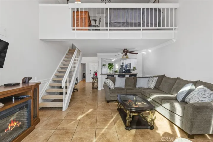 Living room, stairs leading to upstairs loft.