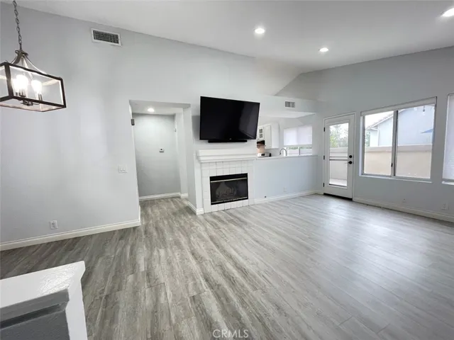 LIVING ROOM, DINING AREA TO LEFT, BREAKFAST BAR, DOOR TO PATIO DECK