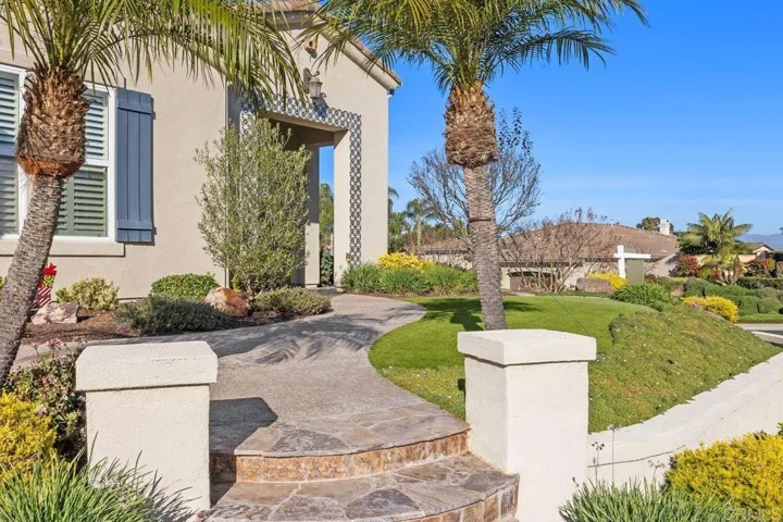 Exquisite grounds with low maintenance, artificial turf.