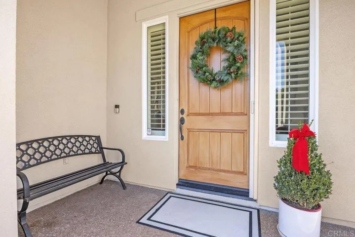 Covered front door entrance with views.
