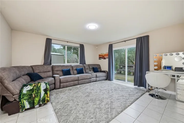 Family room is downstairs and has a sliding door to side deck.