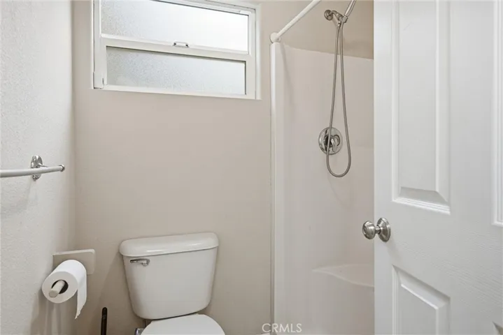 Primary bathroom has a step in shower.