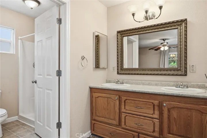 Vanity in primary bath has two sinks.