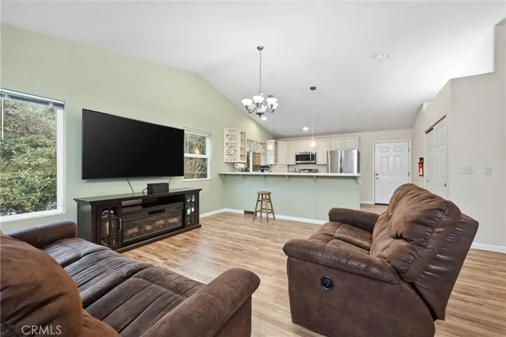 Kitchen is set off by a breakfast bar.