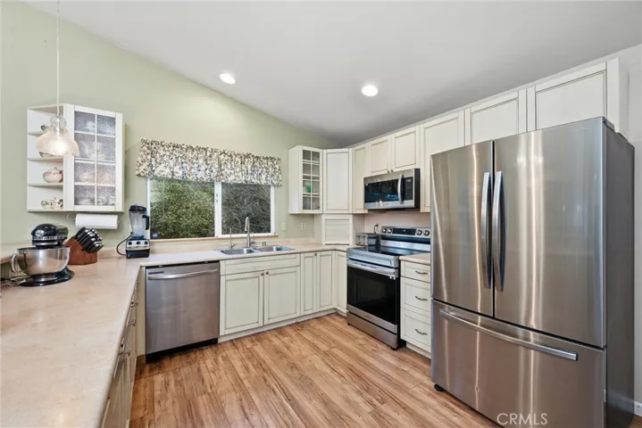 Lots of counter space in the updated kitchen with stainless appliances.