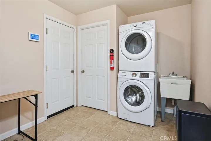 Large laundry area near bedrooms and entry hall.