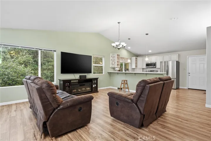 Open living area with door to back deck on the right.