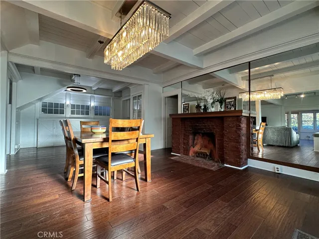 Original 1910 fireplace in great room dining area