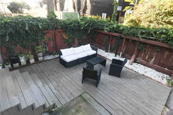 Upper-level landing — transition space overlooking stairs and patio