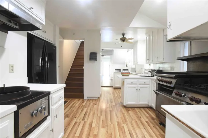 Kitchen — alternate angle showing layout & storage