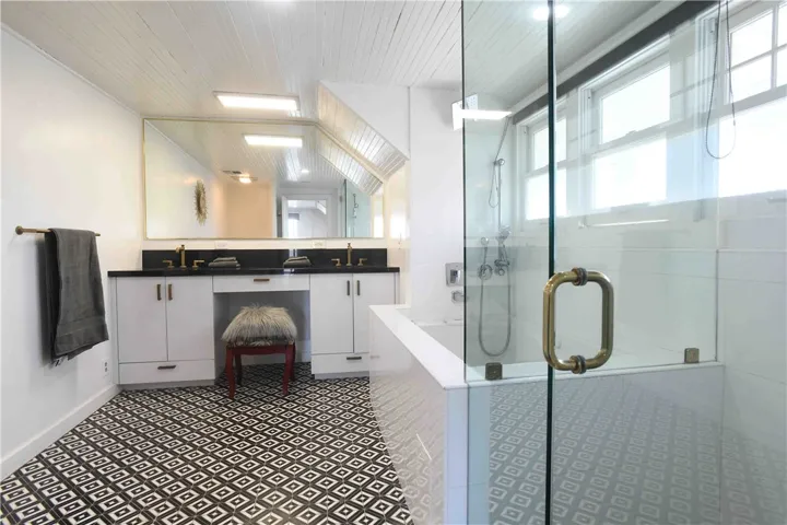 Main bathroom — full view with soaking tub & shower