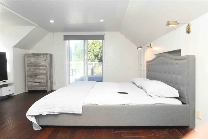 Primary bedroom — alternate angle with custom lighting