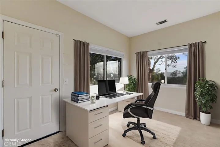 Room inside primary bedroom- virtually staged