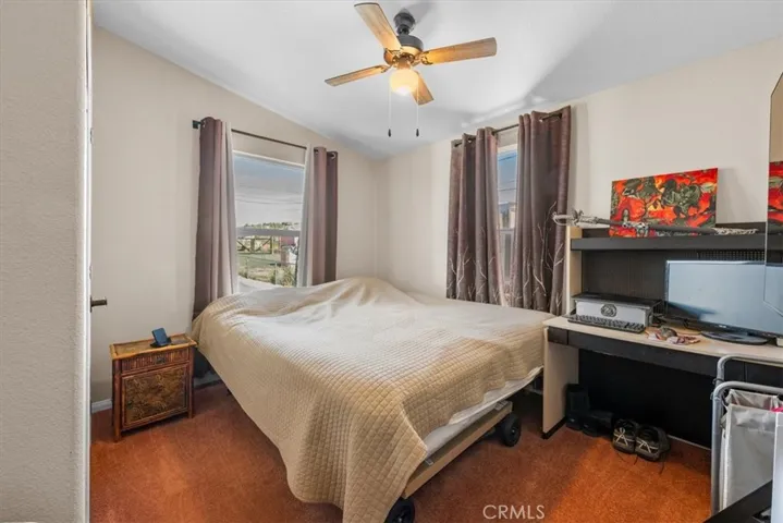 Bedroom lots of natural light and fan