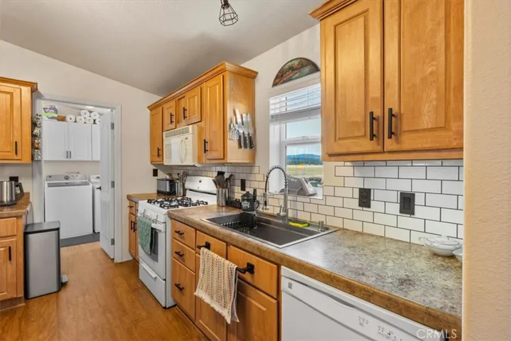 Open kitchen, and showing access to the washroom