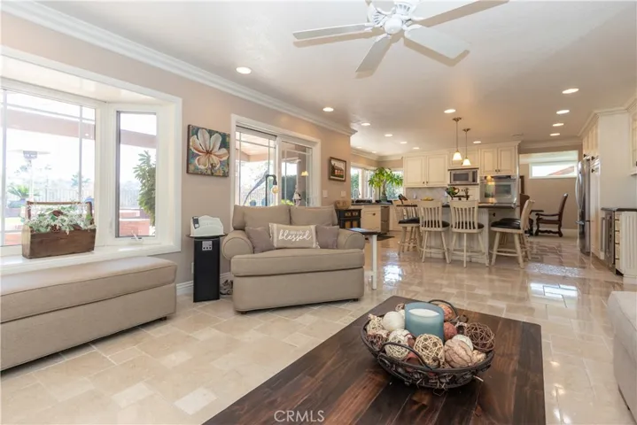 Easy flow to the family room with windows all across the back of the home.