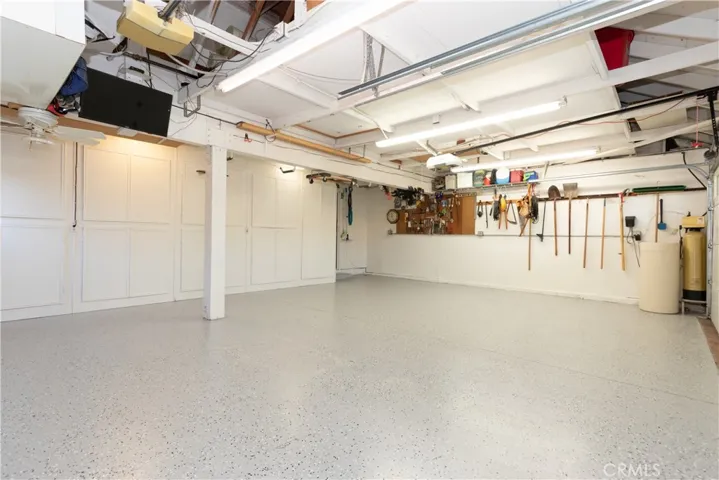 Overhead storage, ceiling fan and more in the garage!