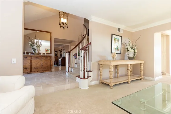 Gracious entry steps down to the formal living spaces.