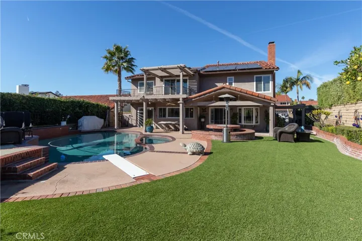 Fabulous backyard with pool, spa, fire pit, covered patio and view.