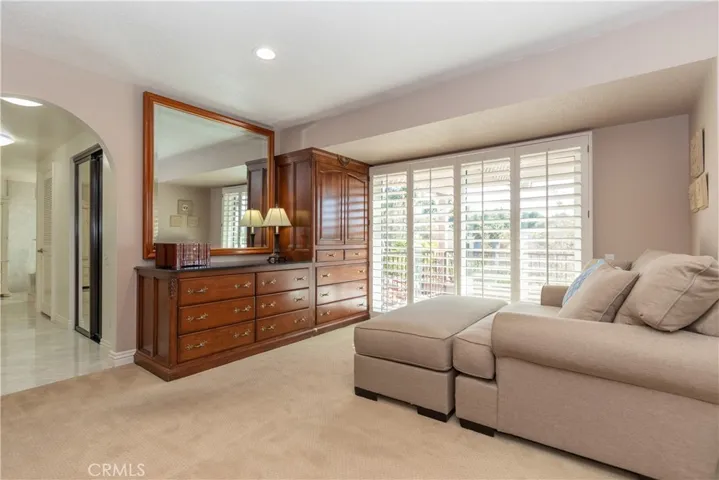 Shuttered slider from the sitting area leads to a view balcony.