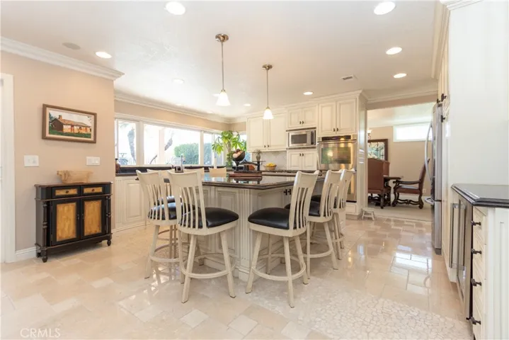Gourmet kitchen with breakfast bar at the island.