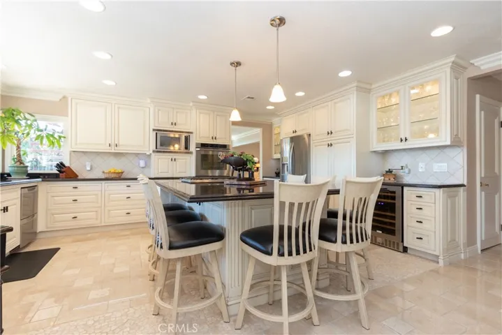 Loads of drawers and cabinets in the kitchen, plus a wine chiller and display cabinet.