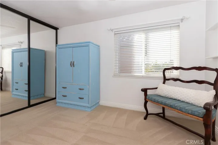 Glass wardrobe doors in the secondary bedroom.