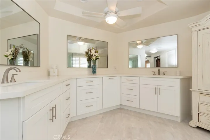Dual vanity and loads of counter and cabinet space.