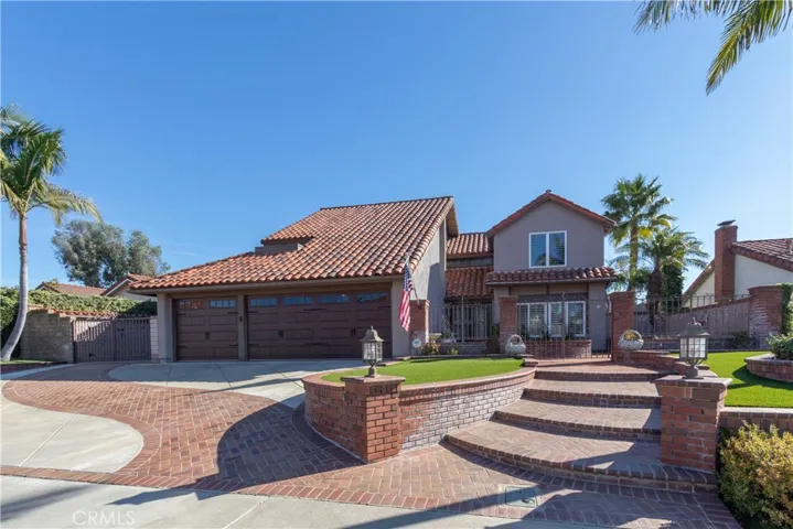 Welcoming front walk and gated courtyard entry.