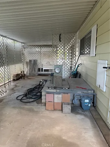 Utility area at the rear of the carport