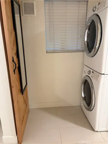Washer and dryer included, located inside the home.