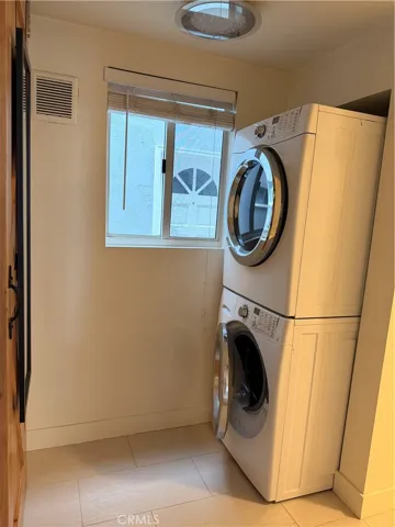 Washer and dryer included, located inside the home.
