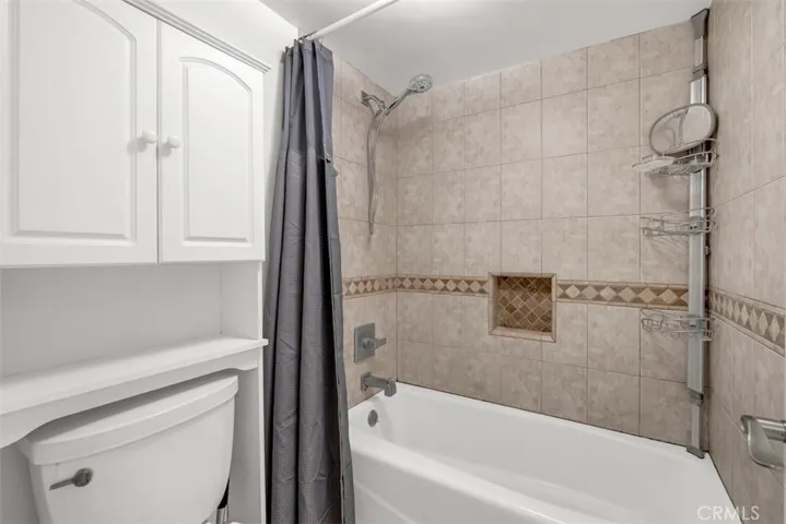 Bathroom contains shower and bathtub.