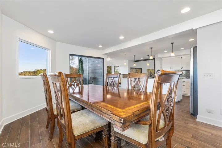 Natural light pours in through the many windows and sliding glass doors.