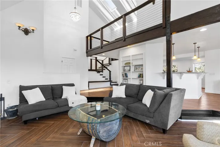 Vaulted ceilings and skylights give the living room a lofty and airy feeling.