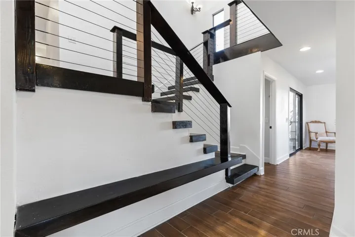 Right away you will notice the contemporary architecture like the cable railing and soaring ceilings.