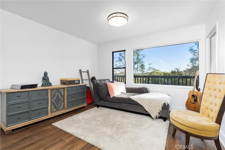 Next to the living room is an area that could be used as a dining area or sitting area as the current owners use it.